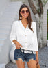 Cárdigan bohemio blanco de punto de crochet calado con borlas estilo 2024